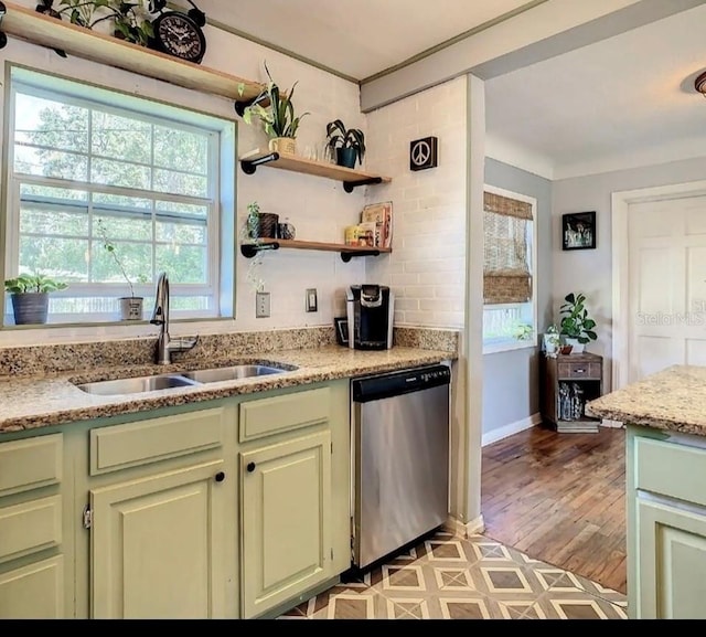 kitchen featuring light hardwood / wood-style flooring, light stone counters, and stainless steel dishwasher