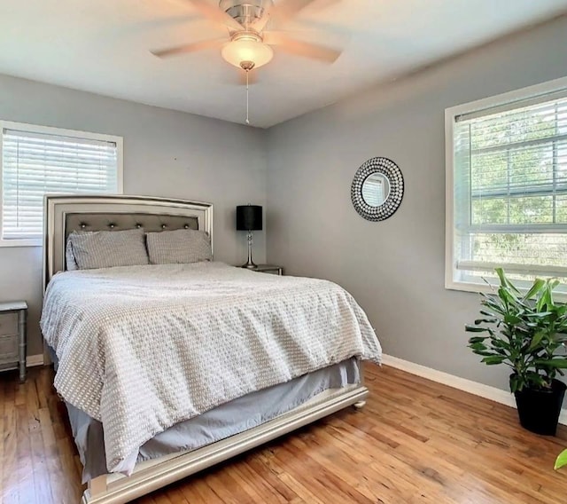 bedroom featuring ceiling fan and wood-type flooring