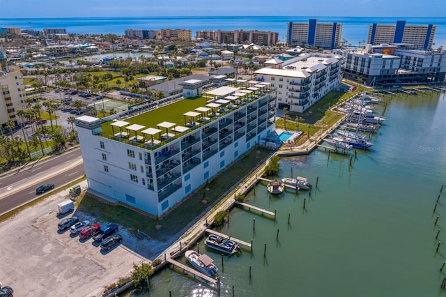 drone / aerial view featuring a water view and a view of city
