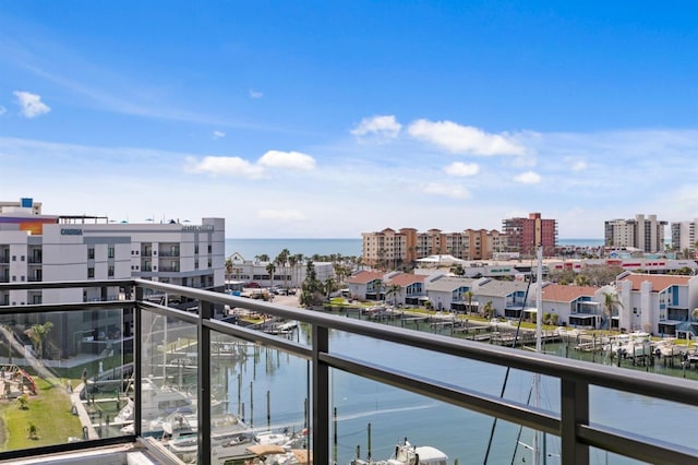 balcony featuring a water view and a view of city