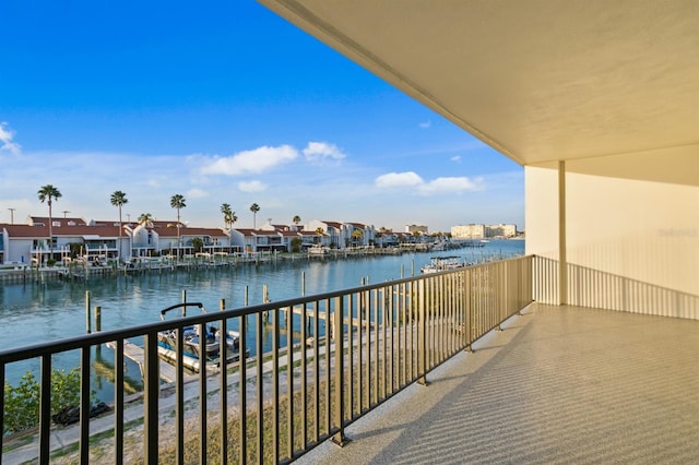 balcony with a water view and a residential view
