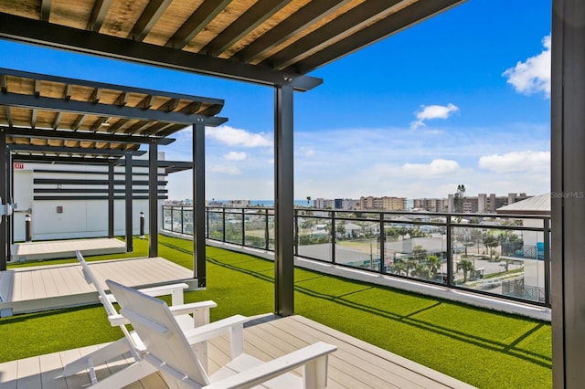 deck with a yard and a city view