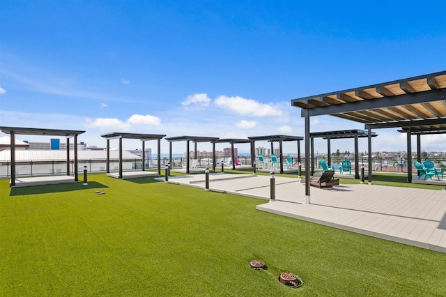 view of home's community featuring a pergola and fence