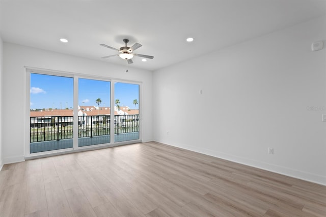 spare room featuring baseboards, ceiling fan, recessed lighting, and light wood-style floors