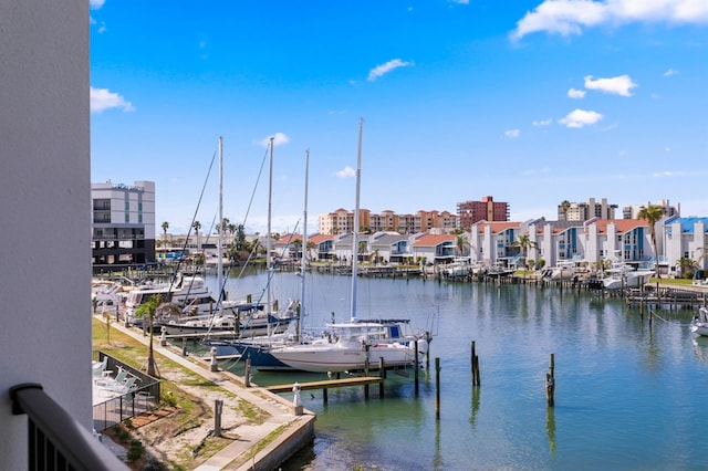 view of dock featuring a residential view and a water view