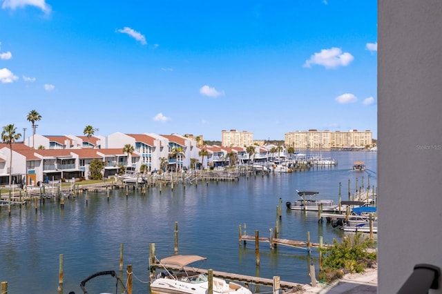 view of dock featuring a residential view and a water view