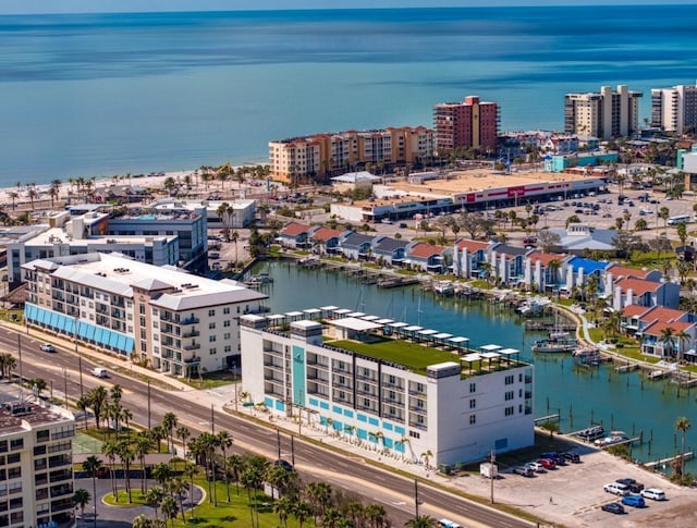 birds eye view of property with a water view and a view of city