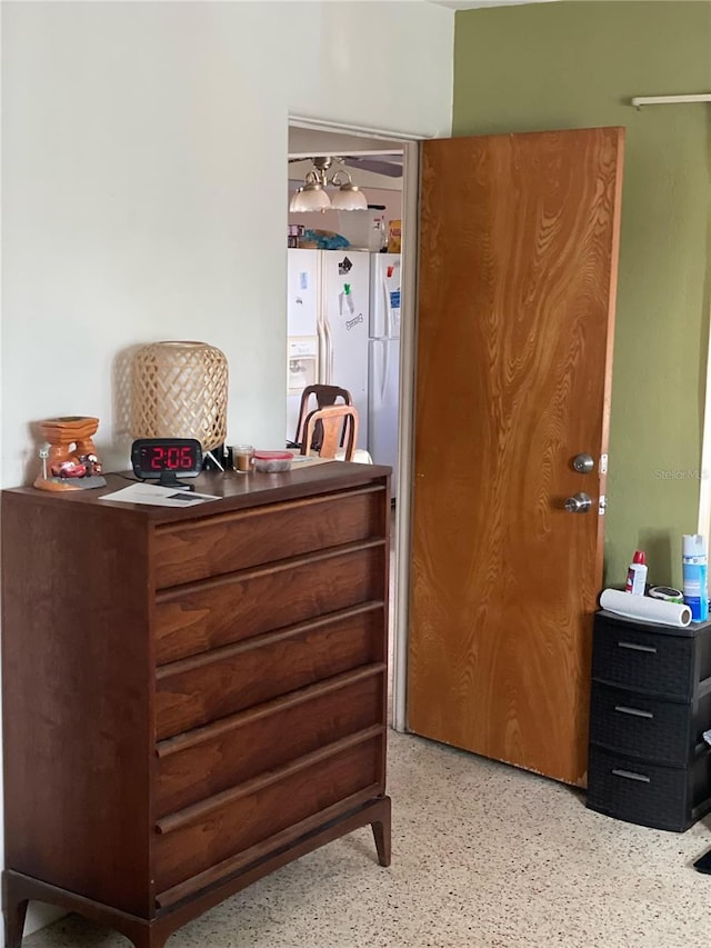 bedroom with white fridge with ice dispenser