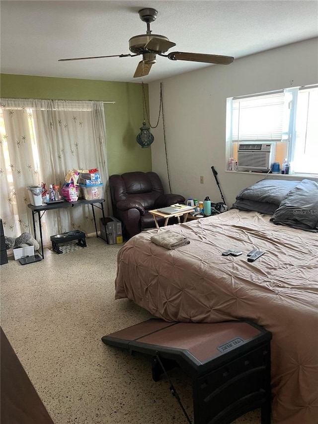 bedroom featuring ceiling fan and cooling unit