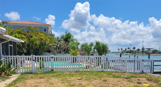 view of swimming pool featuring a water view