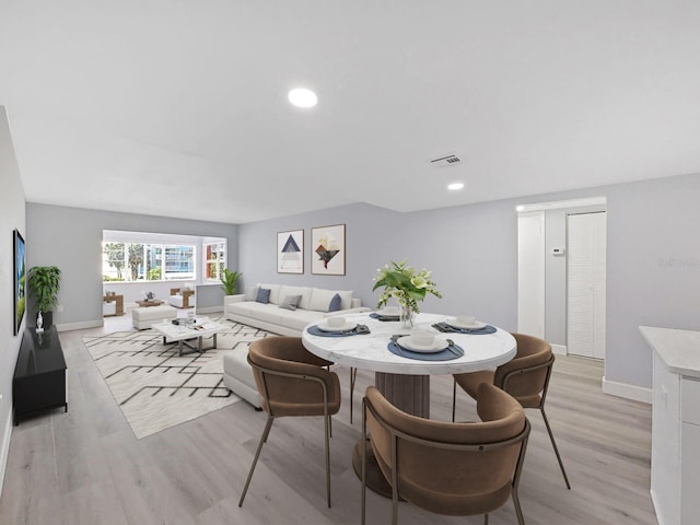 dining room featuring light wood-type flooring