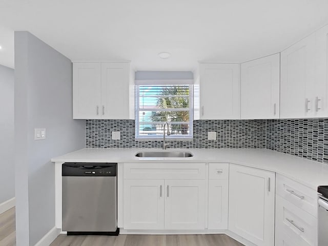 kitchen with white cabinetry, light wood-type flooring, sink, and dishwasher