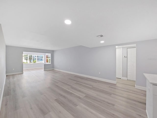 empty room with light hardwood / wood-style floors