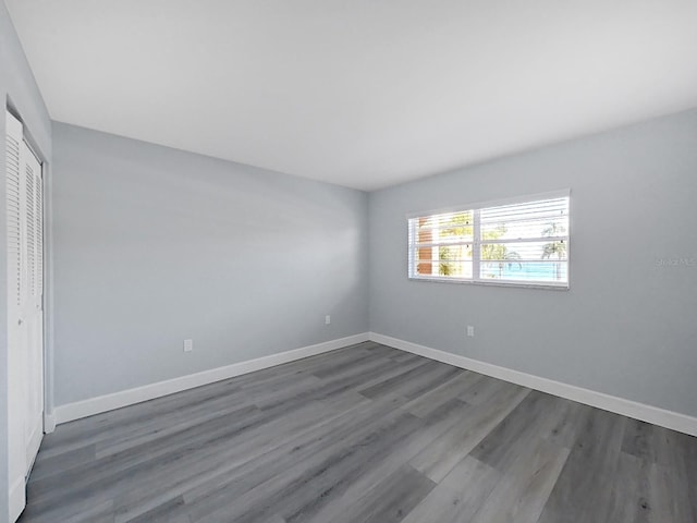 spare room featuring dark hardwood / wood-style flooring