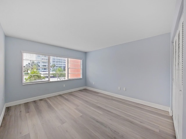 spare room featuring light hardwood / wood-style floors