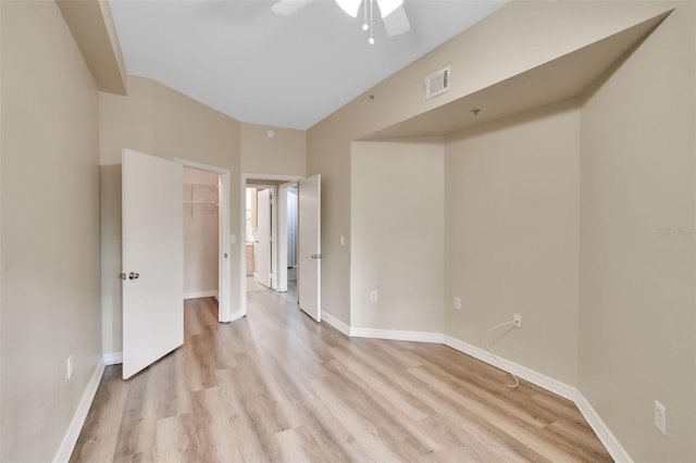 spare room featuring ceiling fan and light hardwood / wood-style flooring