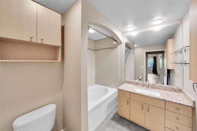 full bathroom featuring vanity, toilet, washtub / shower combination, and a textured ceiling