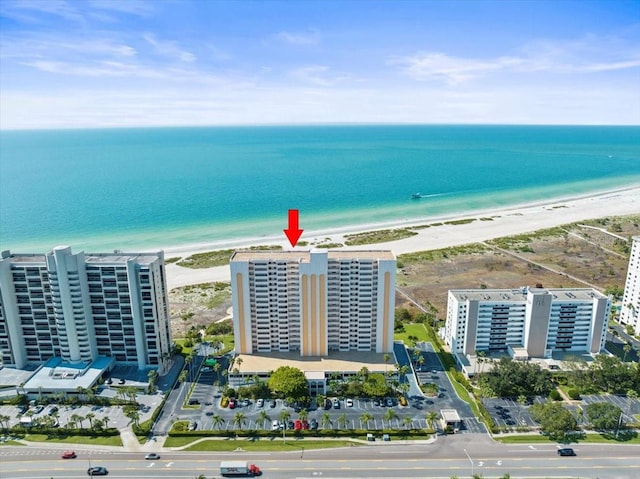 aerial view featuring a water view and a view of the beach