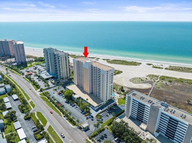 aerial view with a water view and a view of the beach