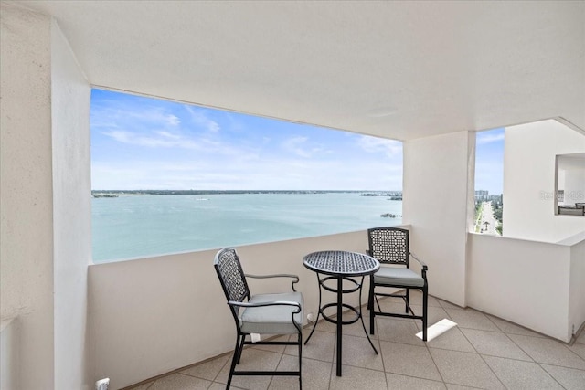 balcony featuring a water view