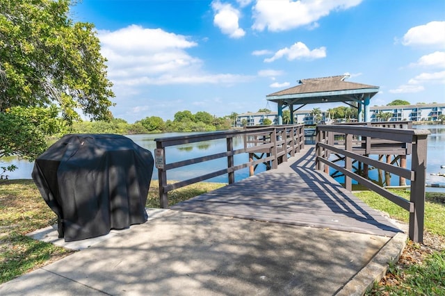 dock area with a water view and a gazebo