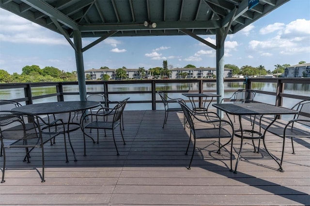 deck featuring a gazebo and a water view