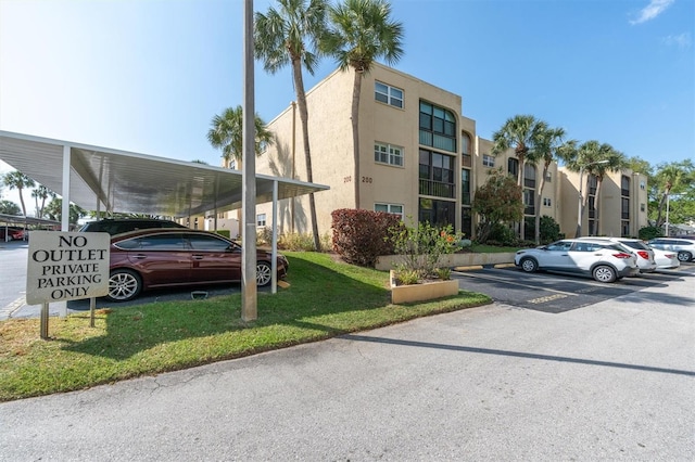 view of building exterior featuring a carport