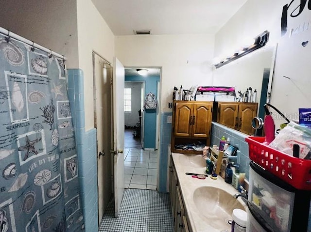 bathroom with vanity and tile flooring