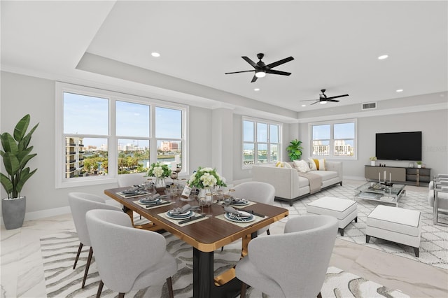 tiled dining room featuring ceiling fan