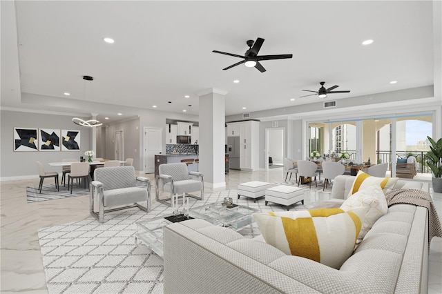 tiled living room featuring ceiling fan