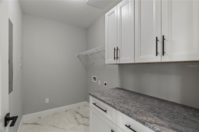 laundry area featuring cabinets, a textured ceiling, washer hookup, electric dryer hookup, and light tile floors