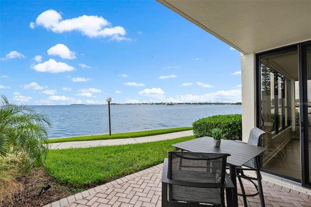 view of patio with a water view