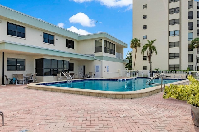 view of swimming pool featuring a patio area