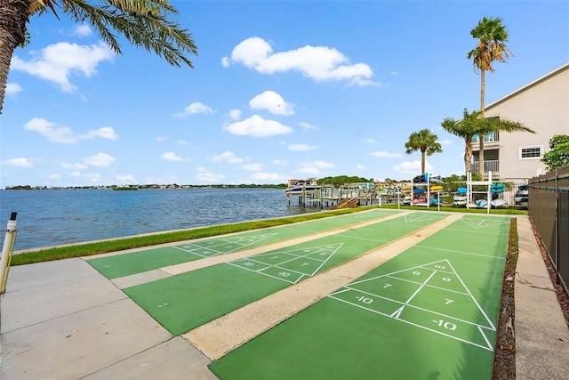 surrounding community with a water view