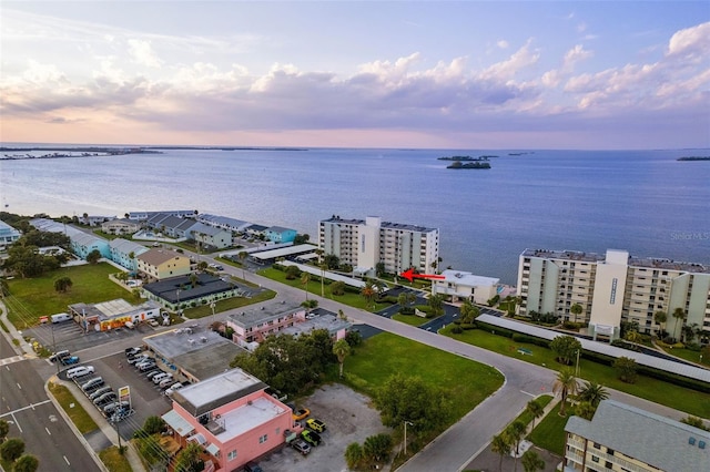 aerial view at dusk with a water view