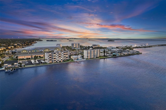 aerial view at dusk with a water view