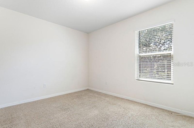 empty room with light colored carpet