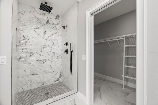 bathroom with tiled shower