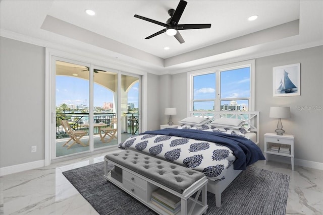 bedroom featuring tile flooring, ceiling fan, access to exterior, and a tray ceiling