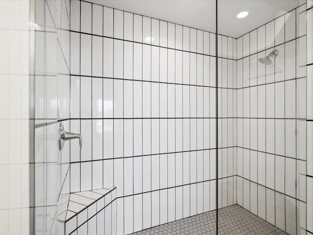 bathroom with a tile shower