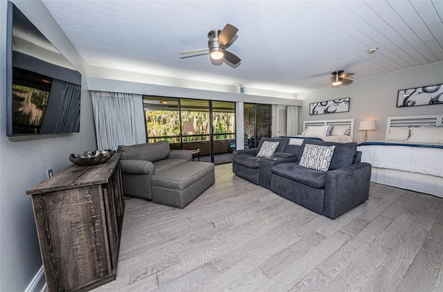 living room with wood ceiling, ceiling fan, and light hardwood / wood-style flooring