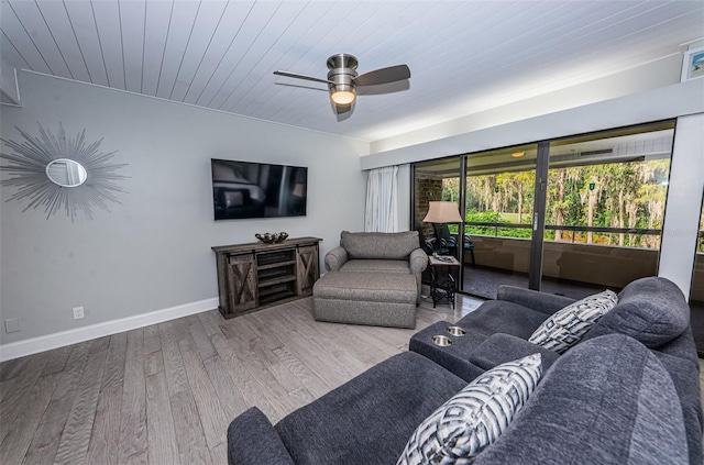 living room with wooden ceiling, ceiling fan, and light hardwood / wood-style flooring