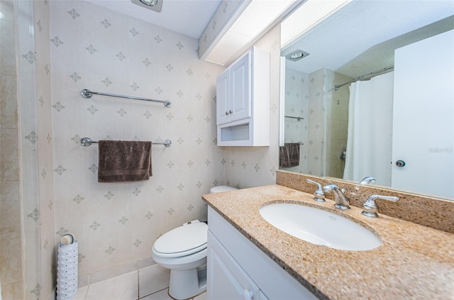 bathroom with toilet, a textured ceiling, tile floors, and large vanity