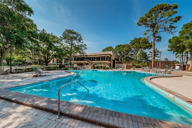 view of swimming pool with a patio