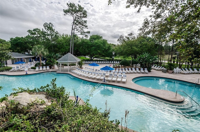 view of swimming pool featuring a gazebo and a patio