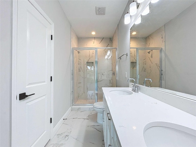 full bathroom featuring baseboards, double vanity, a sink, toilet, and marble finish floor