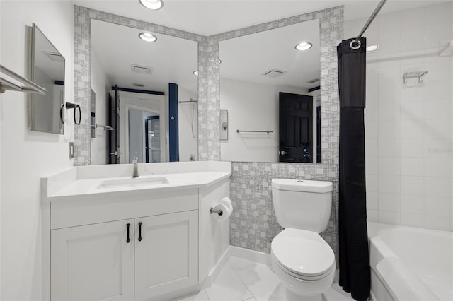 full bathroom with shower / tub combo with curtain, tile walls, tile patterned flooring, vanity, and toilet