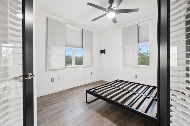 bedroom featuring light hardwood / wood-style flooring and ceiling fan