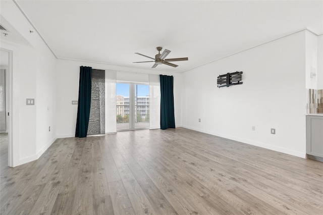 spare room with ceiling fan and light hardwood / wood-style floors