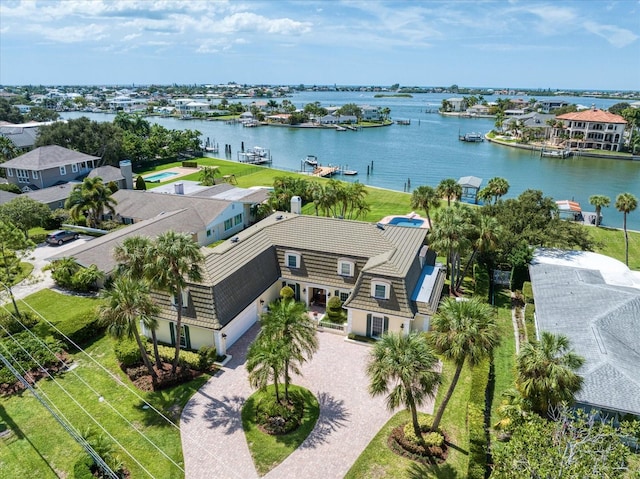 birds eye view of property with a water view